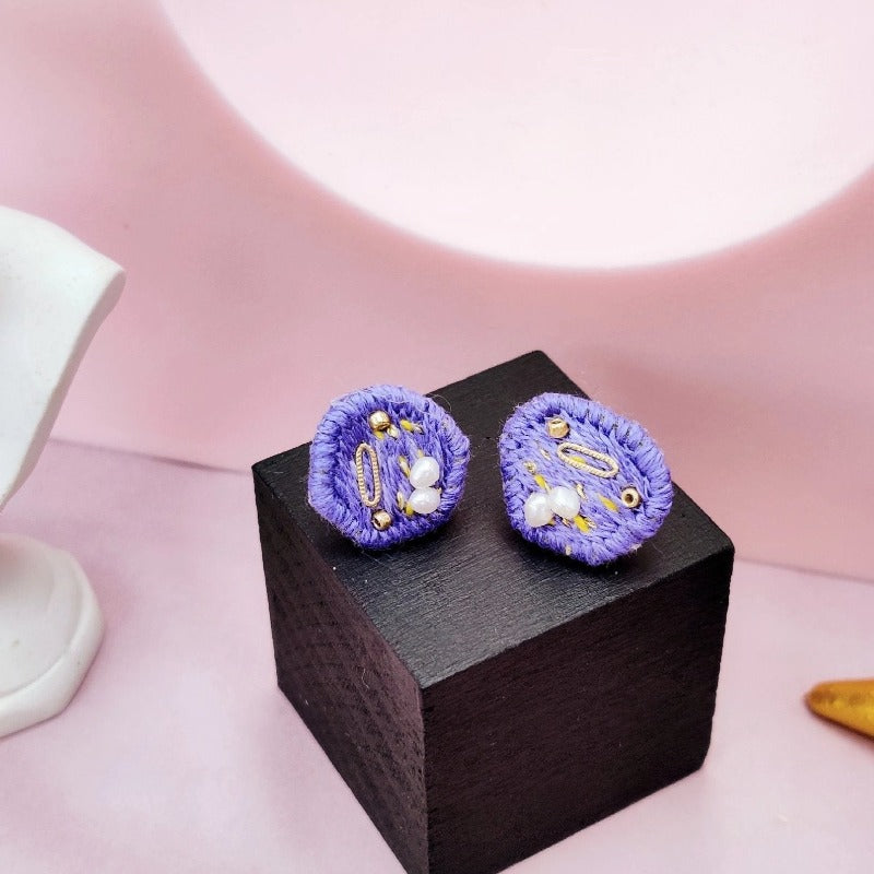 purple embroidered earrings